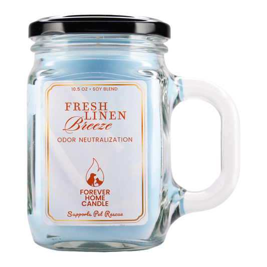 Jar candle labeled 'Fresh Linen Breeze' with a handle on a white background